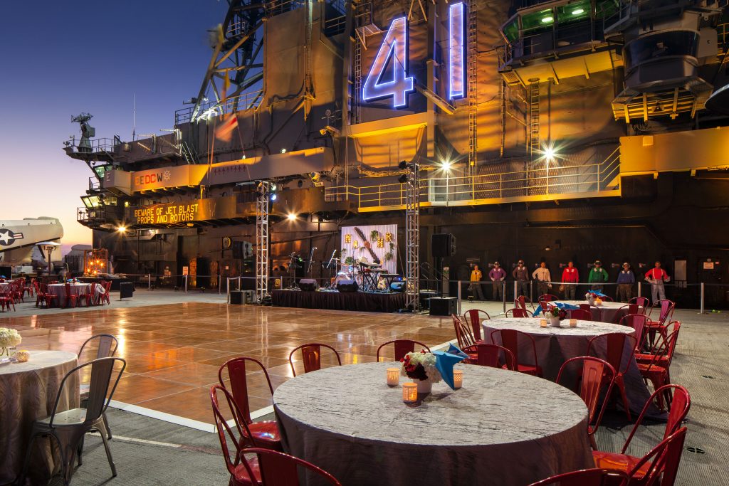 Main stage of the Midway with table surrounding the dance floor.