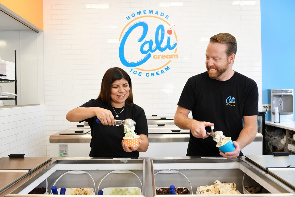 Cali Cream owners Juliana and Ken scooping ice cream.